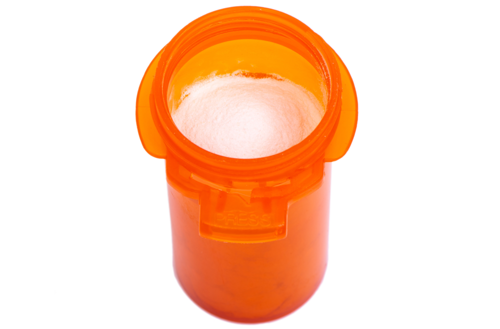 An orange vial with medication 
